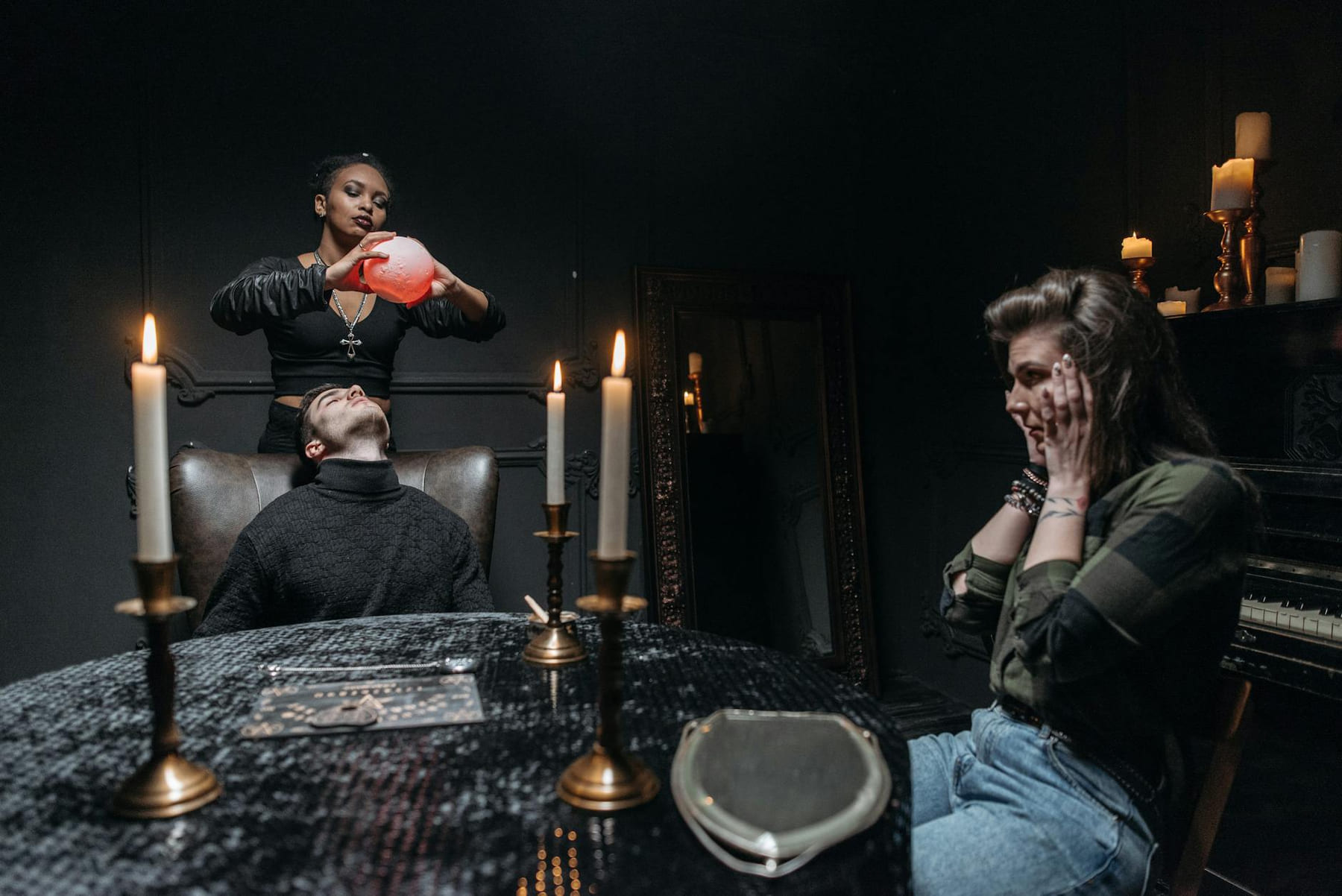 A mystical seance scene with candles and a medium performing a ritual. The atmosphere is dark and spiritual. on The Manifesting Light