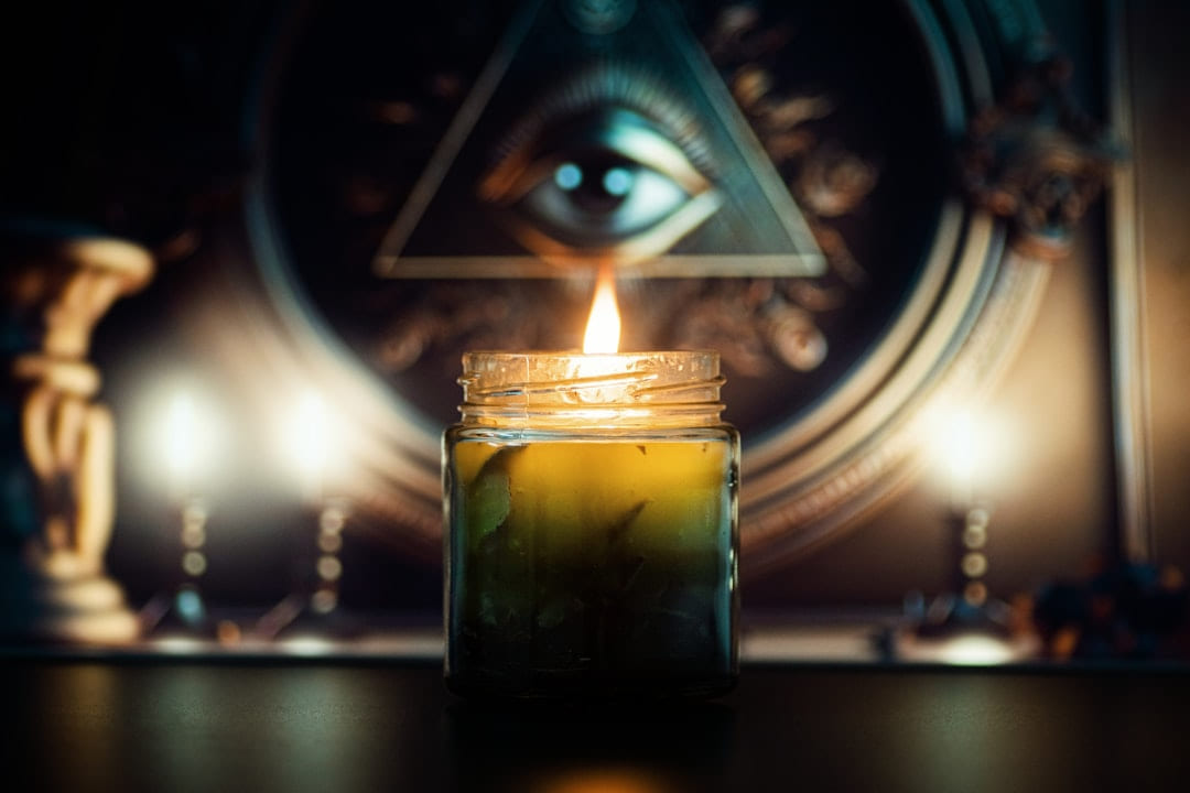a candle that is sitting on a table on The Manifesting Light