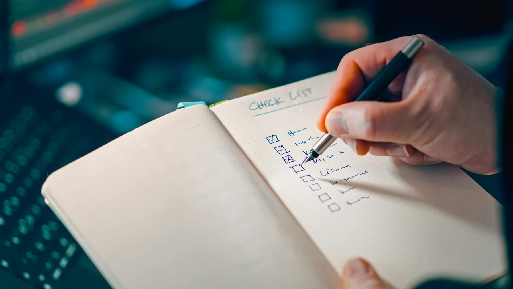 Close-up of a hand writing in a notebook with a checklist for effective task management. on The Manifesting Light